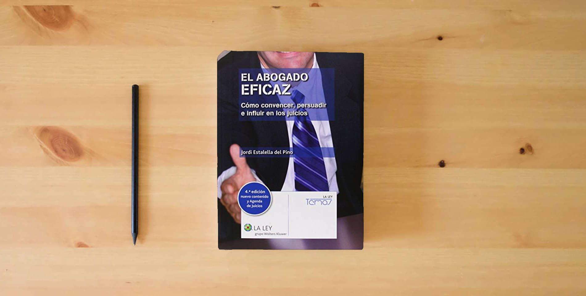 The book Abogado eficaz, El (4ª ed.) Cómo convencer, persuadir e influir en los juicios + (Temas La Ley) is on the table