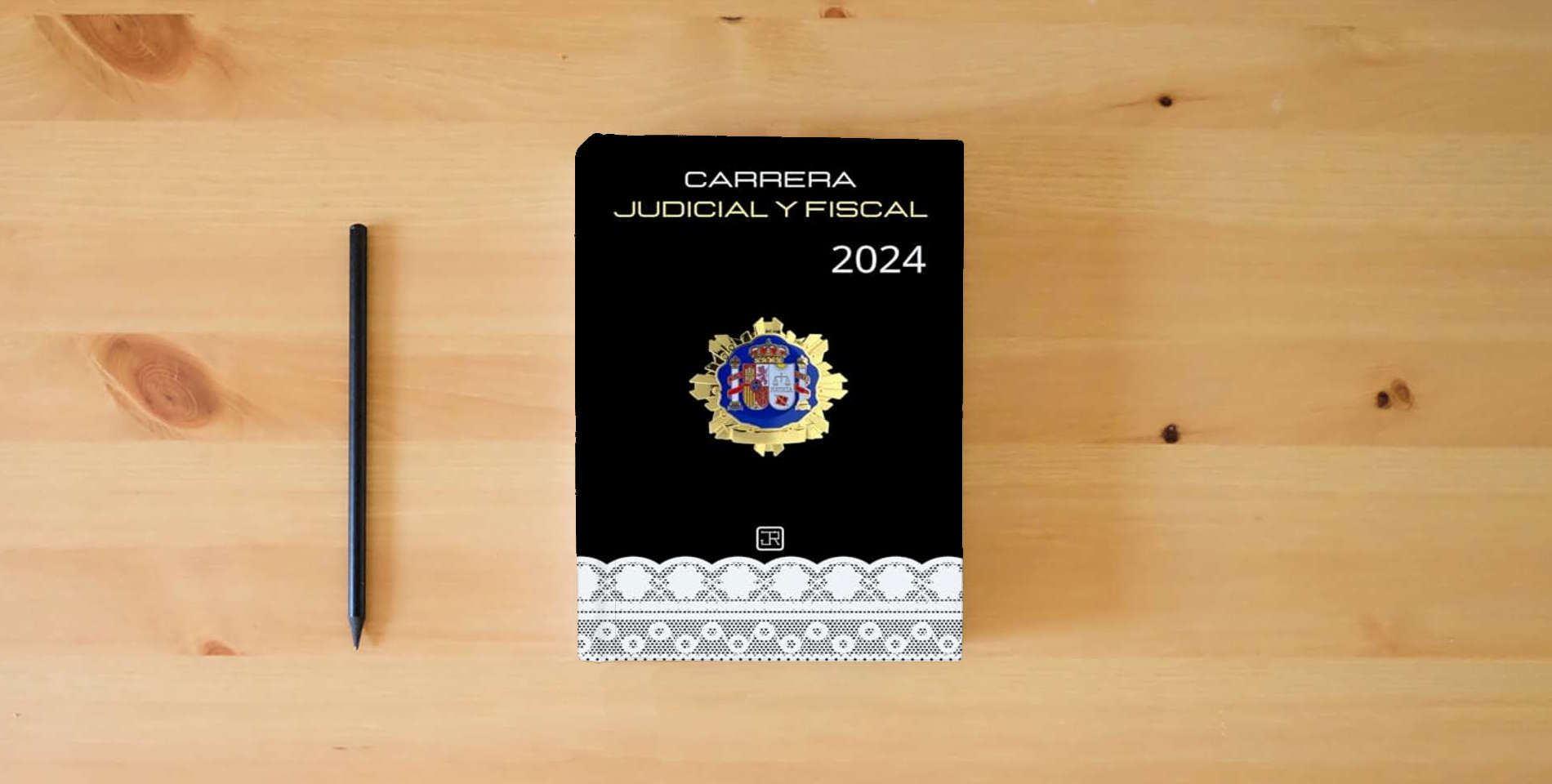 The book Agenda para Opositores de Carrera Judicial y Fiscal 2024 (Agendas para Oposiciones) is on the table
