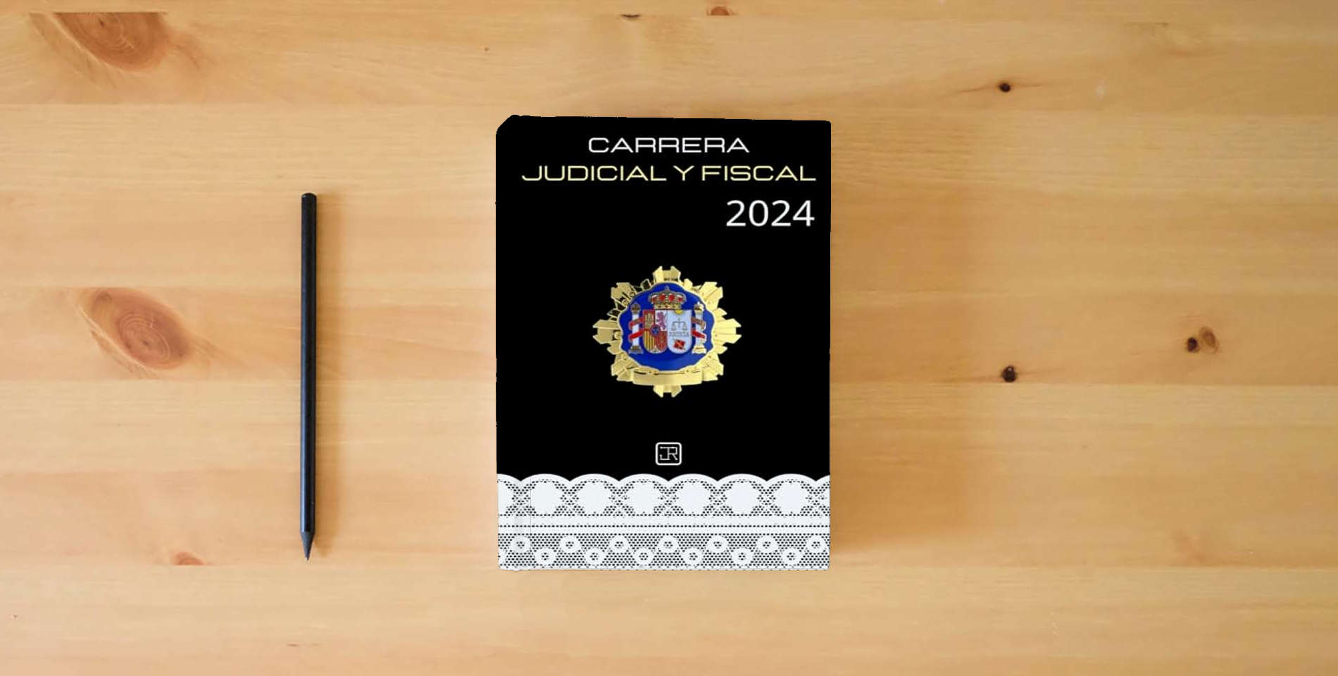 The book Agenda para Opositores de Carrera Judicial y Fiscal 2024 (OpoAgendas) is on the table