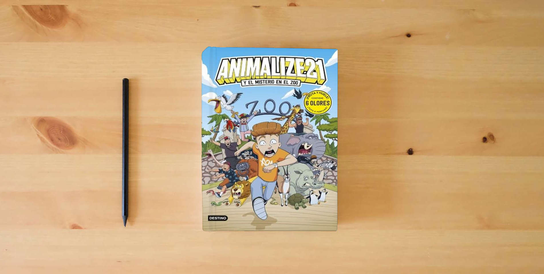The book Animalize 21 2. Animalize 21 y el misterio en el zoo: Libro con olores (Jóvenes influencers) is on the table
