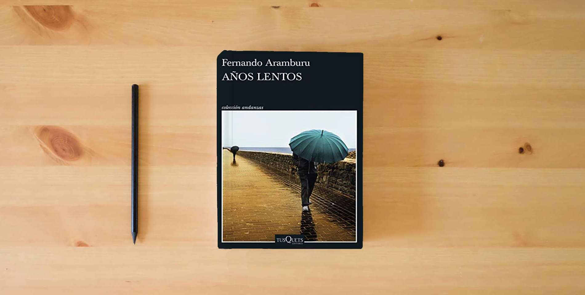 The book Años lentos (Andanzas) is on the table