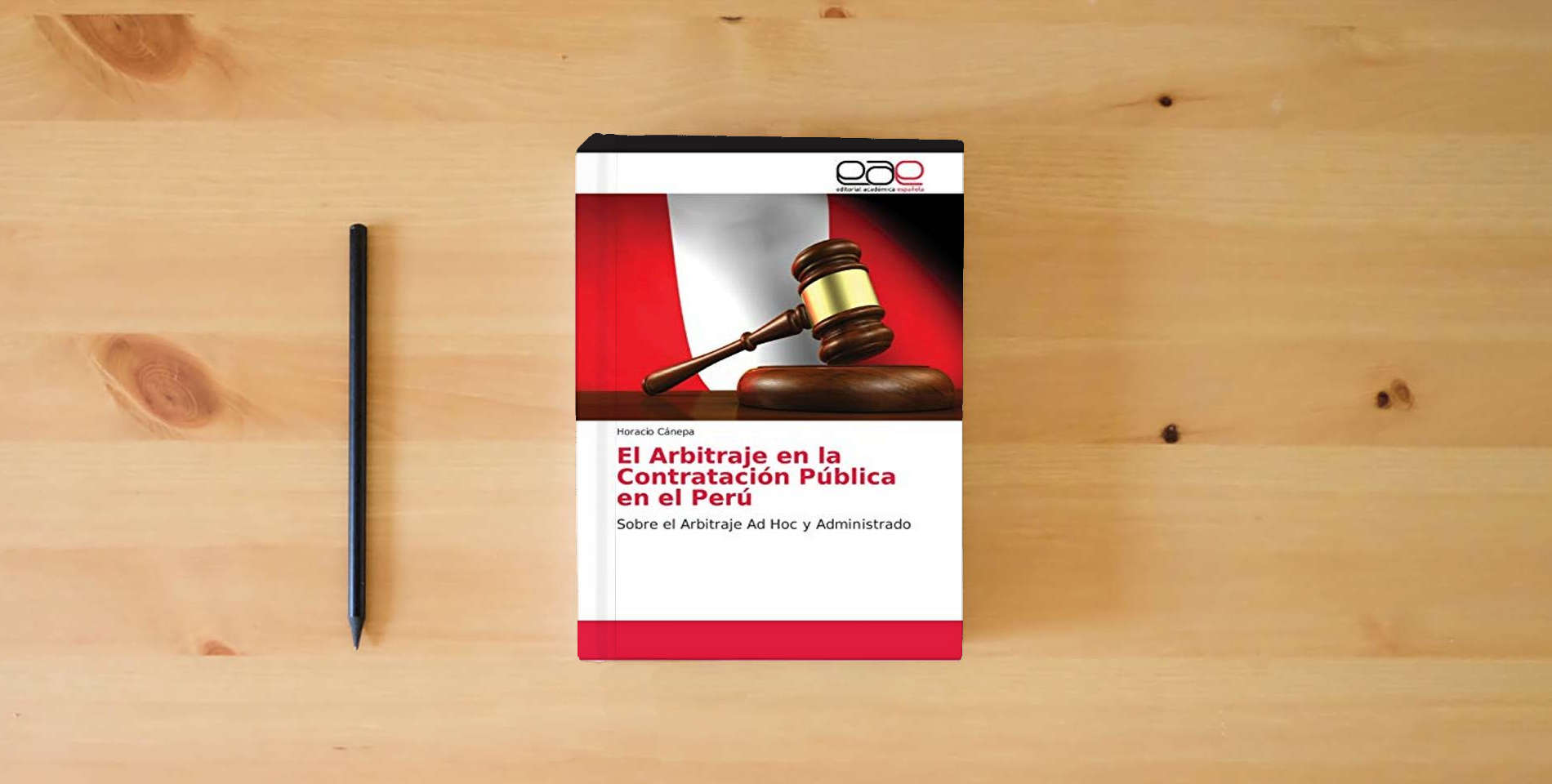 The book El Arbitraje en la Contratación Pública en el Perú: Sobre el Arbitraje Ad Hoc y Administrado is on the table