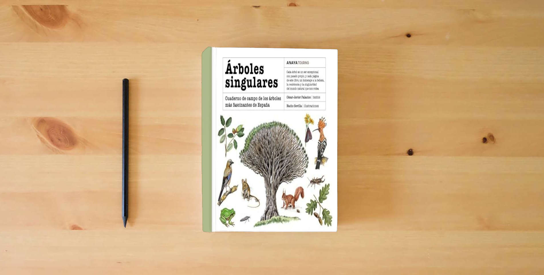The book Árboles singulares: Cuaderno de campo de los árboles más fascinantes de España (Guías Singulares) is on the table