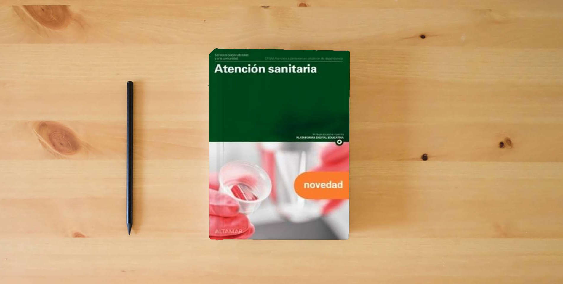 The book ATENCION SANITARIA GM 25 CF AT.PERSONAS SITUACION (CFGM ATENCIÓN A PERSONAS EN SITUACIÓN DE DEPENDENC) is on the table