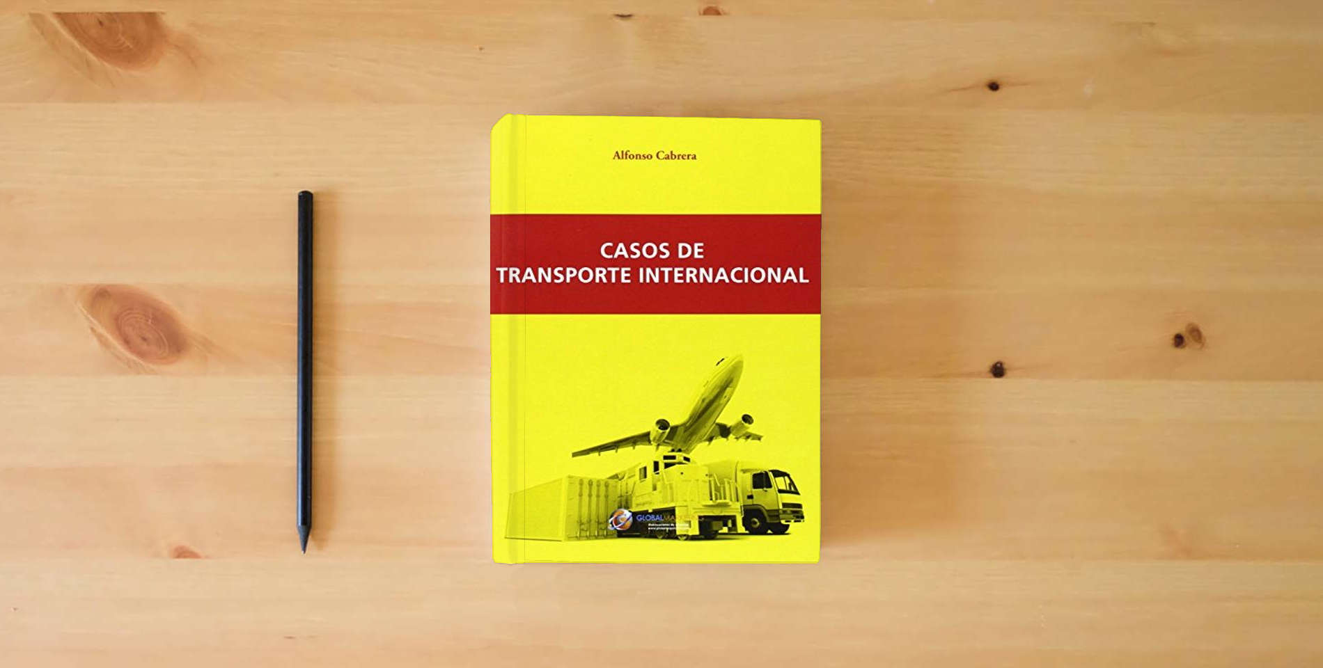 The book Casos De Transporte Internacional (ECONOMIA) is on the table