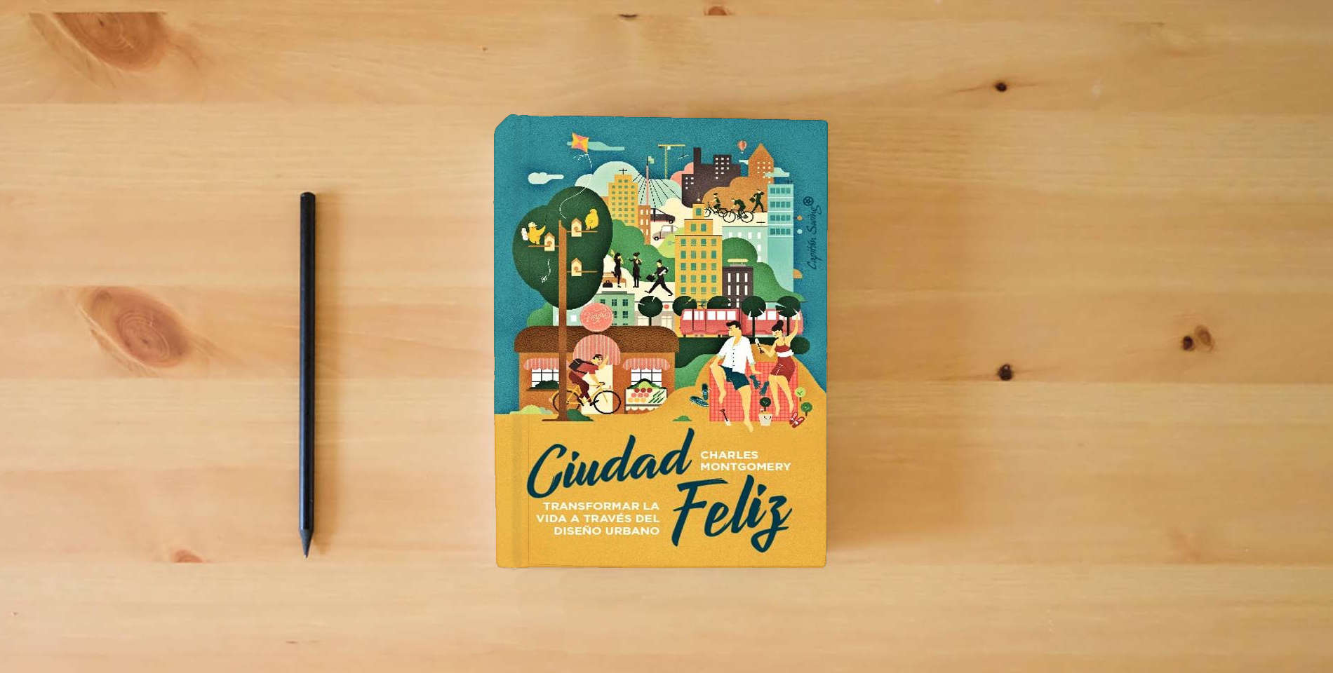 The book Ciudad Feliz: Transformar la vida a través del diseño urbano (ENSAYO) is on the table
