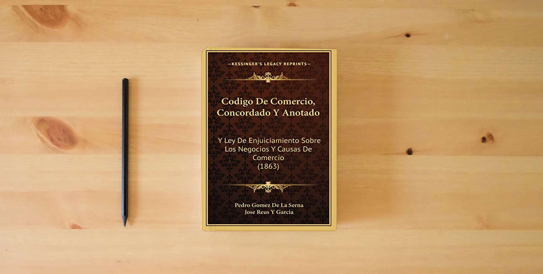 The book Codigo De Comercio, Concordado Y Anotado: Y Ley De Enjuiciamiento Sobre Los Negocios Y Causas De Comercio (1863) is on the table