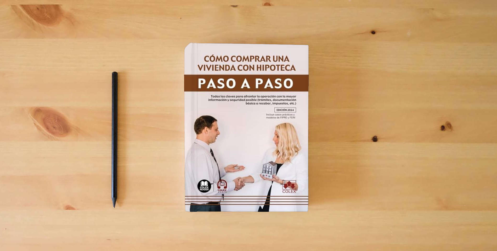 The book Cómo comprar una vivienda con hipoteca. Paso a paso (1.ª edición 2024): Todas las claves para afrontar la operación con la mayor información y ... básica a recabar, impuestos, etc.) is on the table