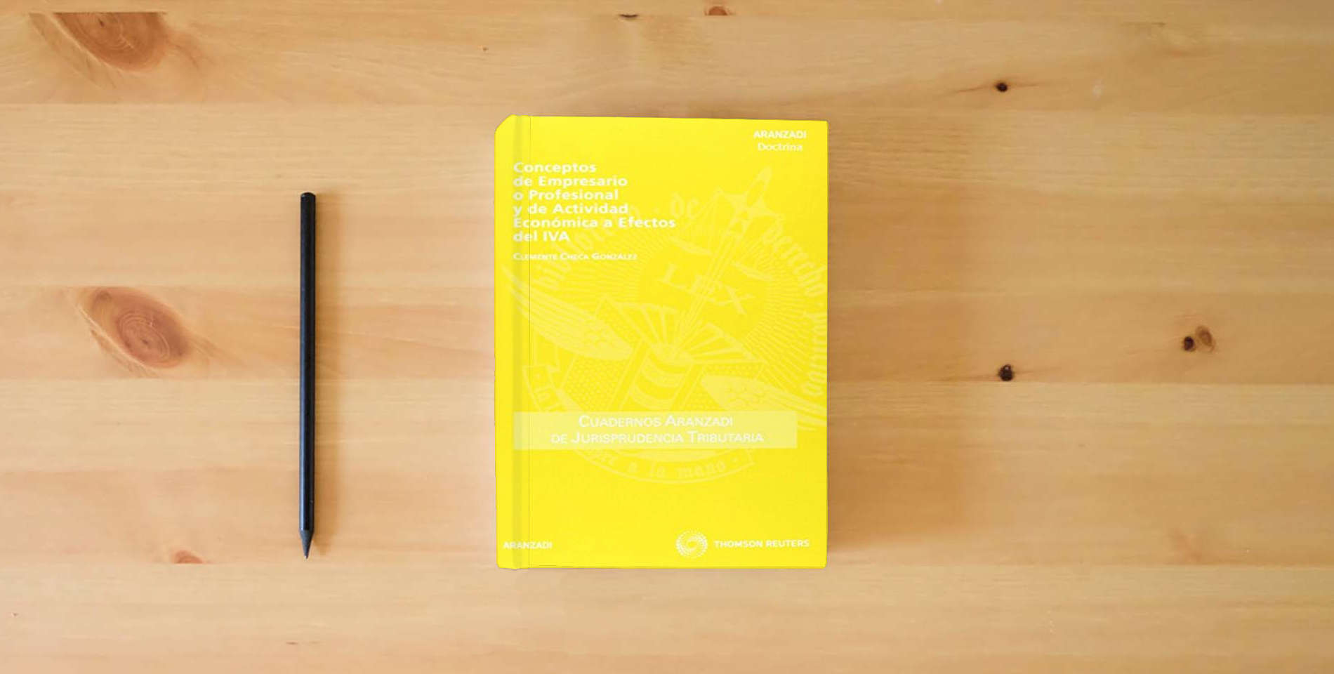 The book Conceptos de Empresario o Profesional y de Actividad Económica a Efectos del IVA: 57 (Cuadernos - Jurisprudencia Tributaria) is on the table