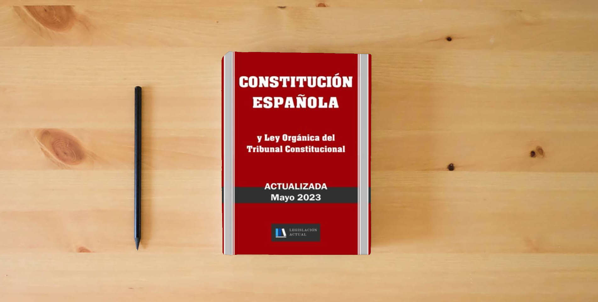 The book CONSTITUCIÓN ESPAÑOLA y Ley Orgánica del Tribunal Constitucional. Actualizada.: Para profesionales, estudiantes y opositores. is on the table