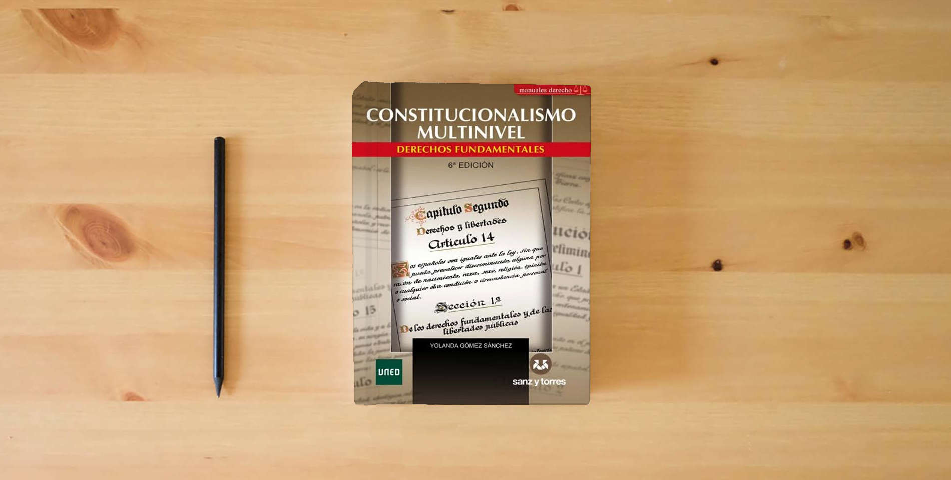 The book Constitucionalismo Multinivel (6ª Edición): Derechos Fundamentales is on the table