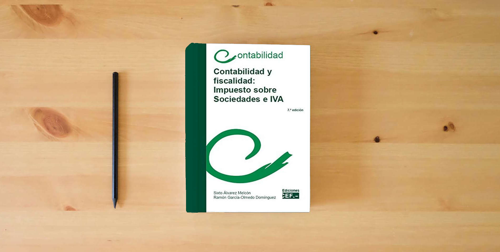 The book Contabilidad y fiscalidad: impuesto sobre sociedades e IVA is on the table