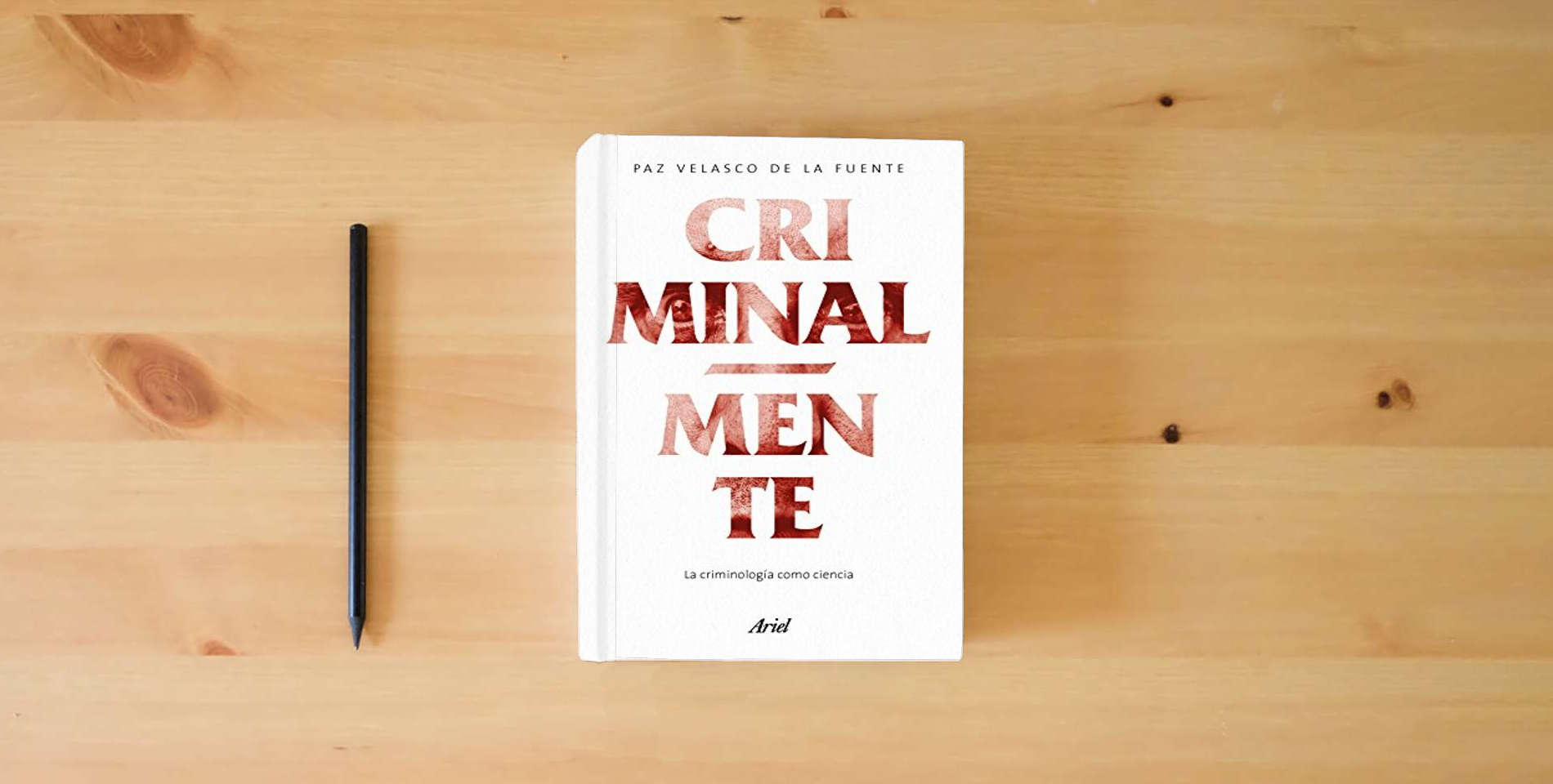 The book Criminalmente: La criminología como ciencia (Ariel) is on the table