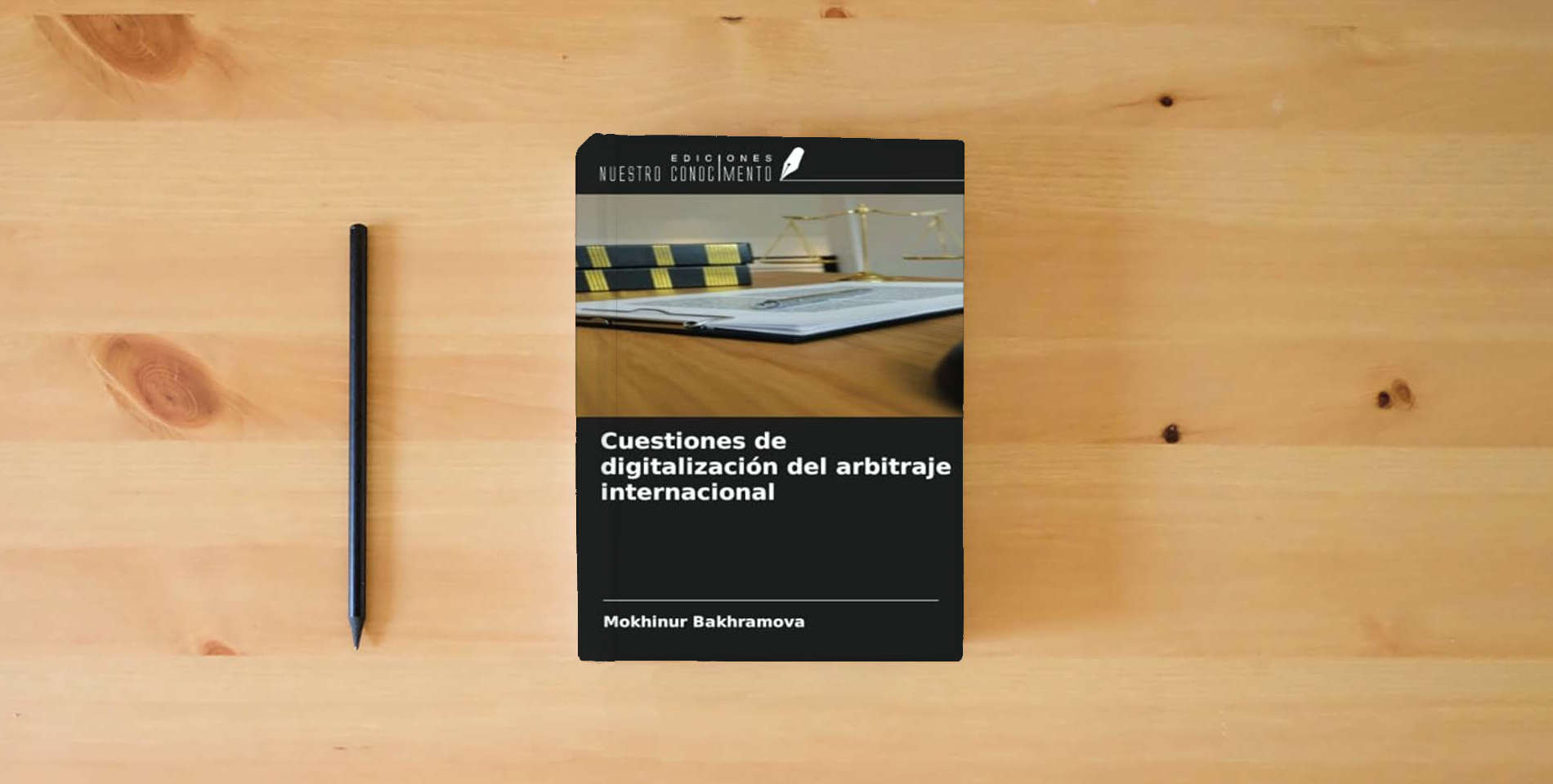 The book Cuestiones de digitalización del arbitraje internacional is on the table