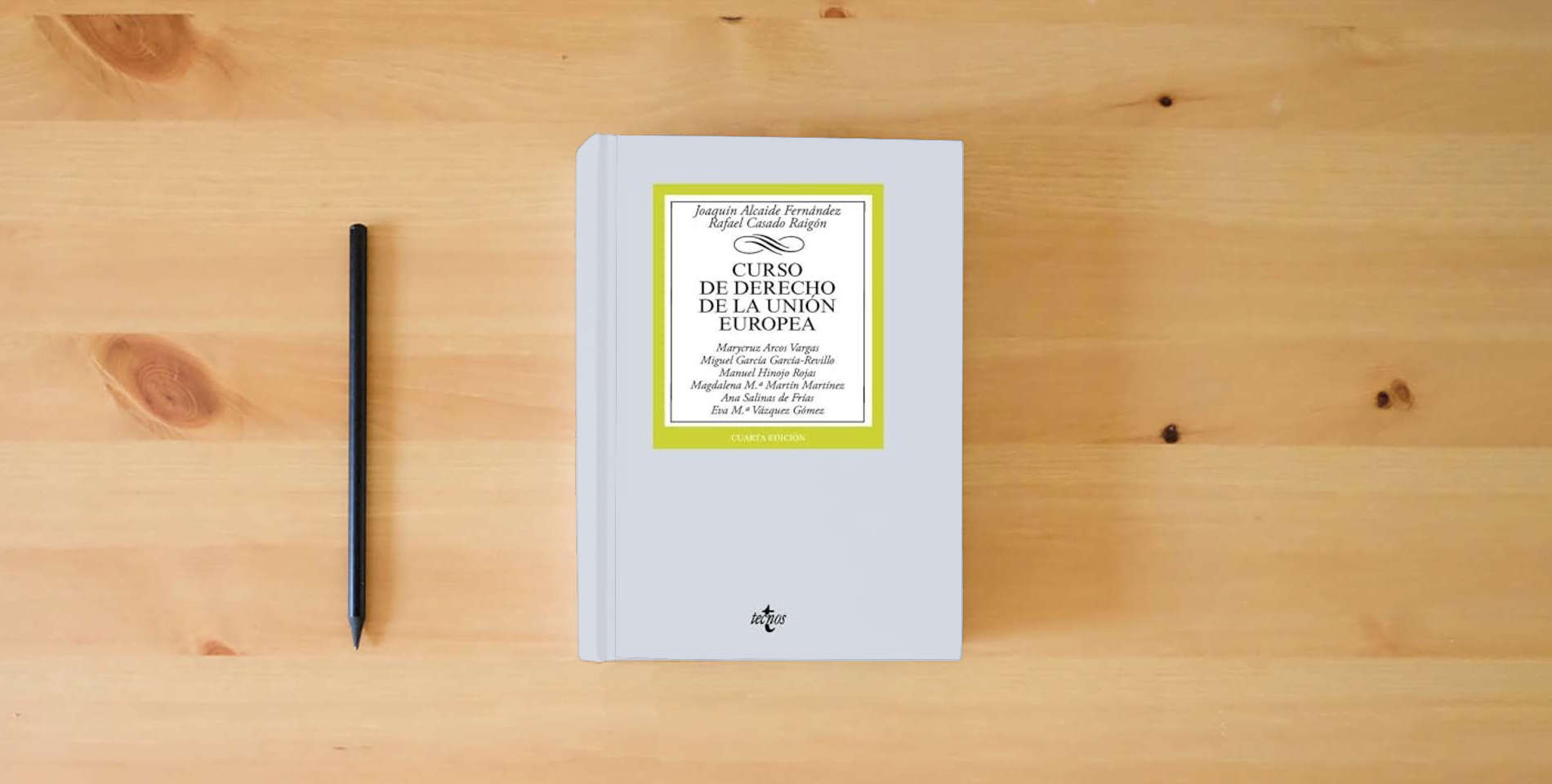 The book Curso de Derecho de la Unión Europea (Derecho - Biblioteca Universitaria de Editorial Tecnos) is on the table