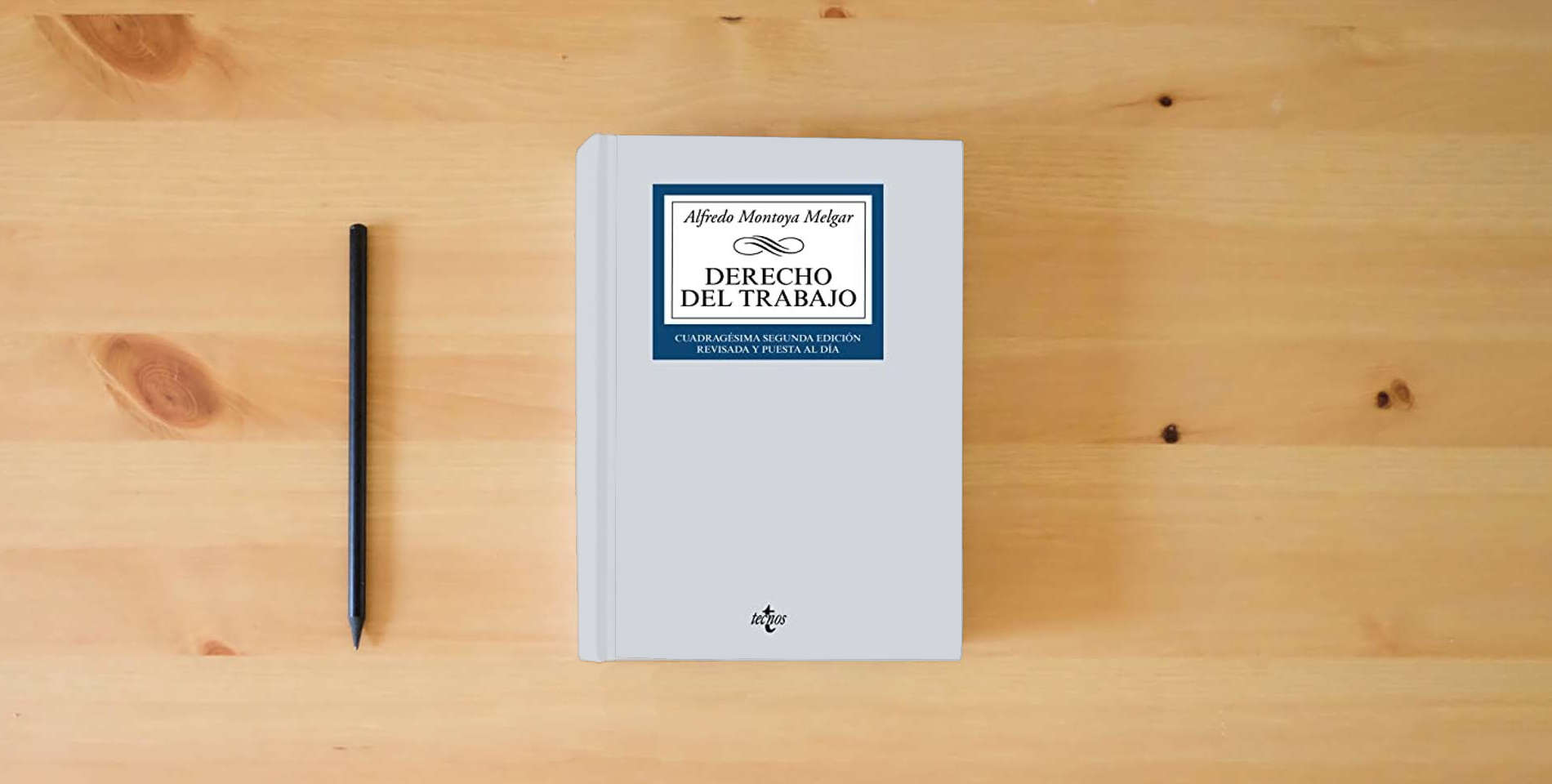 The book Derecho del Trabajo (Derecho - Biblioteca Universitaria de Editorial Tecnos) is on the table