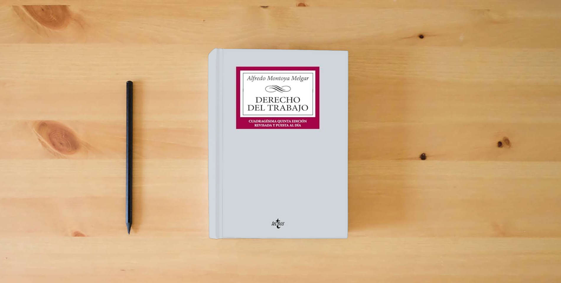 The book Derecho del Trabajo (Derecho - Biblioteca Universitaria de Editorial Tecnos) is on the table