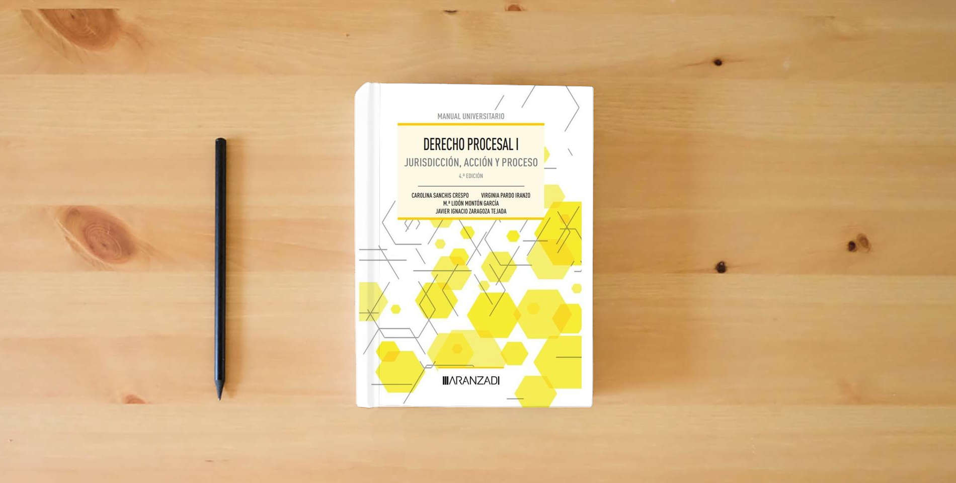 The book Derecho Procesal I: Jurisdicción, acción y proceso (Manuales) is on the table