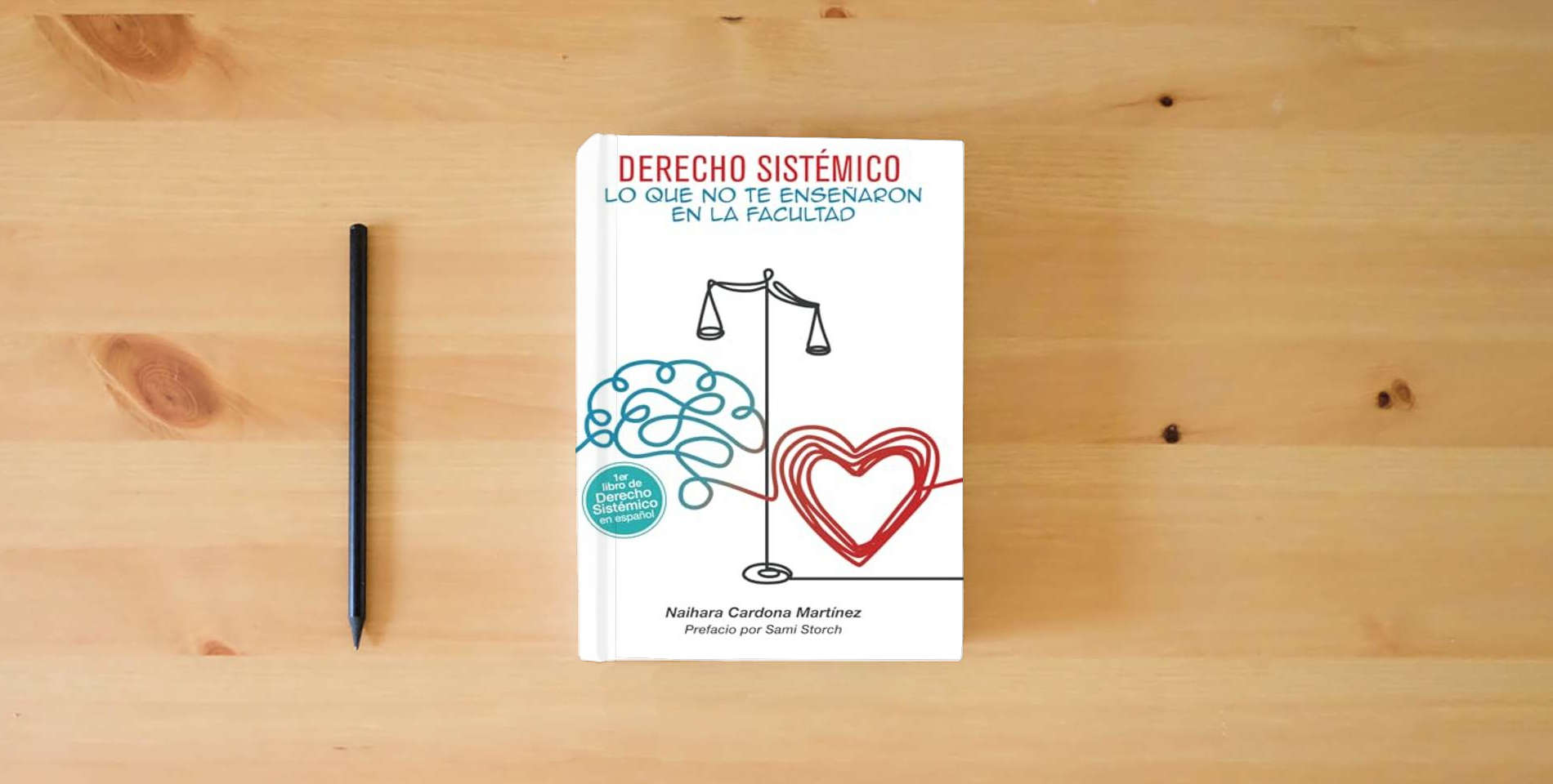 The book Derecho sistémico: Lo que no te enseñaron en la facultad is on the table