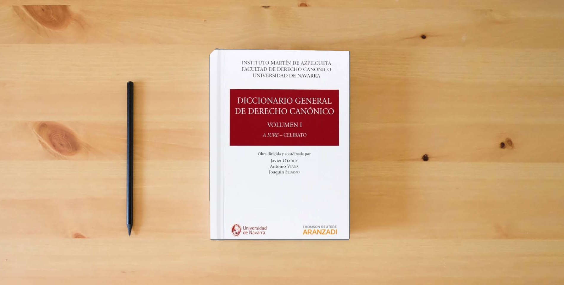 The book Diccionario General de Derecho Canónico (Tomos I a VII) is on the table