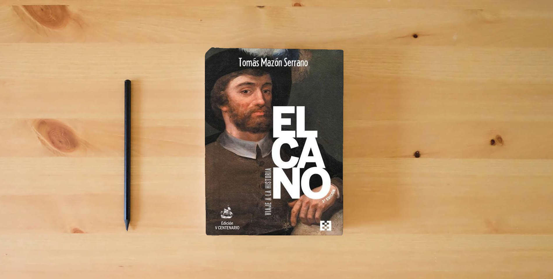 The book ELCANO, VIAJE A LA HISTORIA: Tercera edición (Ed. Rústica): 112 (NUEVO ENSAYO) is on the table