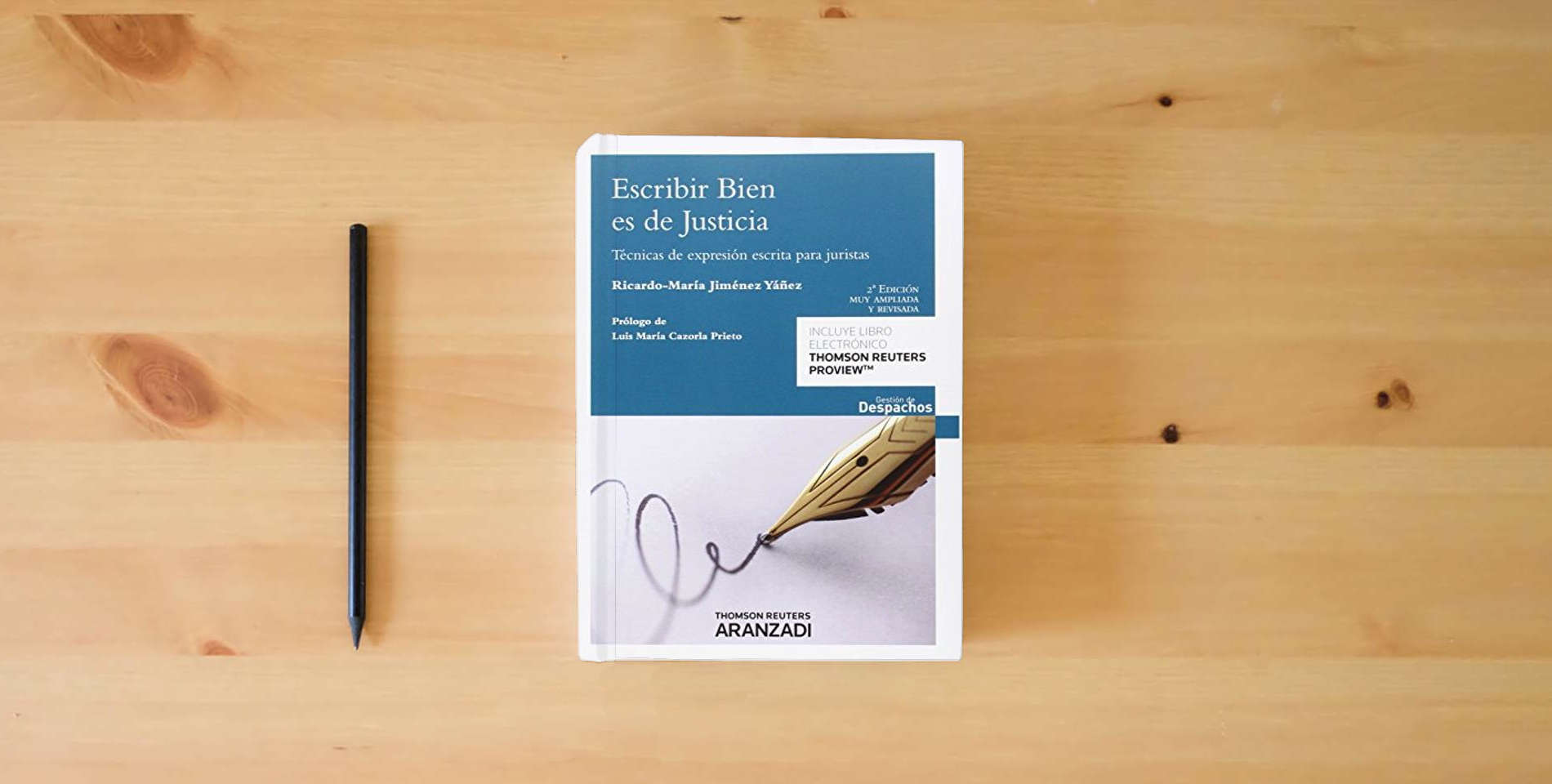The book Escribir bien es de justicia: Técnicas de expresión escrita para juristas (Gestión de Despachos) is on the table