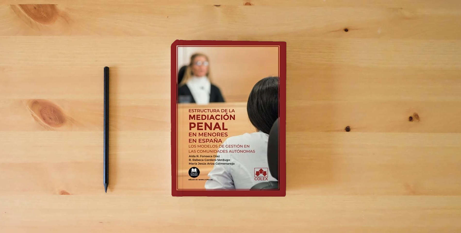 The book Estructura de la mediación penal en menores en España: Los modelos de gestión en las comunidades autónomas: 1 (Monografía) is on the table