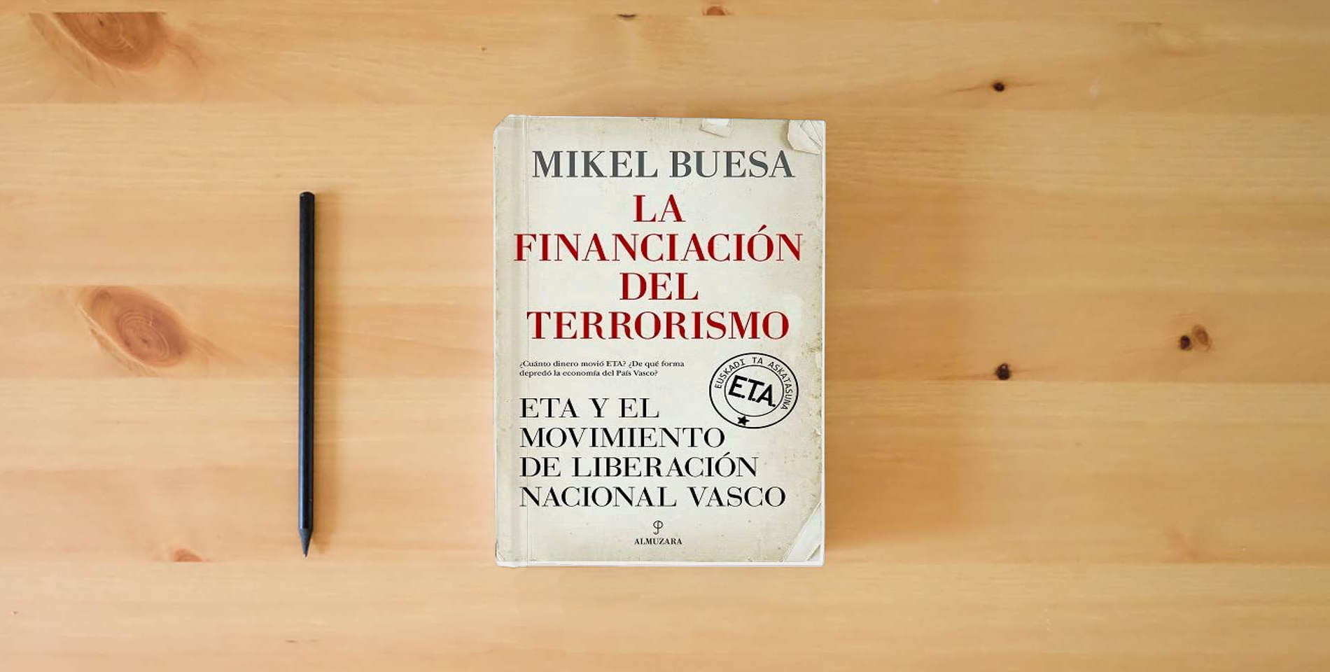 The book La financiación del terrorismo; ETA y el Movimiento de Liberación Nacional Vasco (Pensamiento político) is on the table