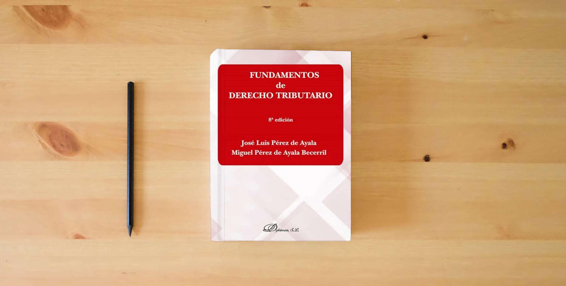 The book Fundamentos de Derecho Tributario (SIN COLECCION) is on the table