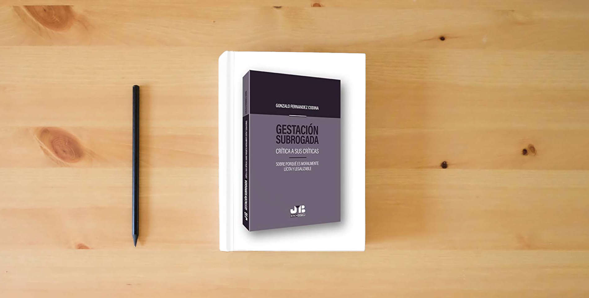 The book Gestación subrogada: Crítica a sus críticas. Sobre porqué es moralmente lícita y legalizable (BOSCH) is on the table