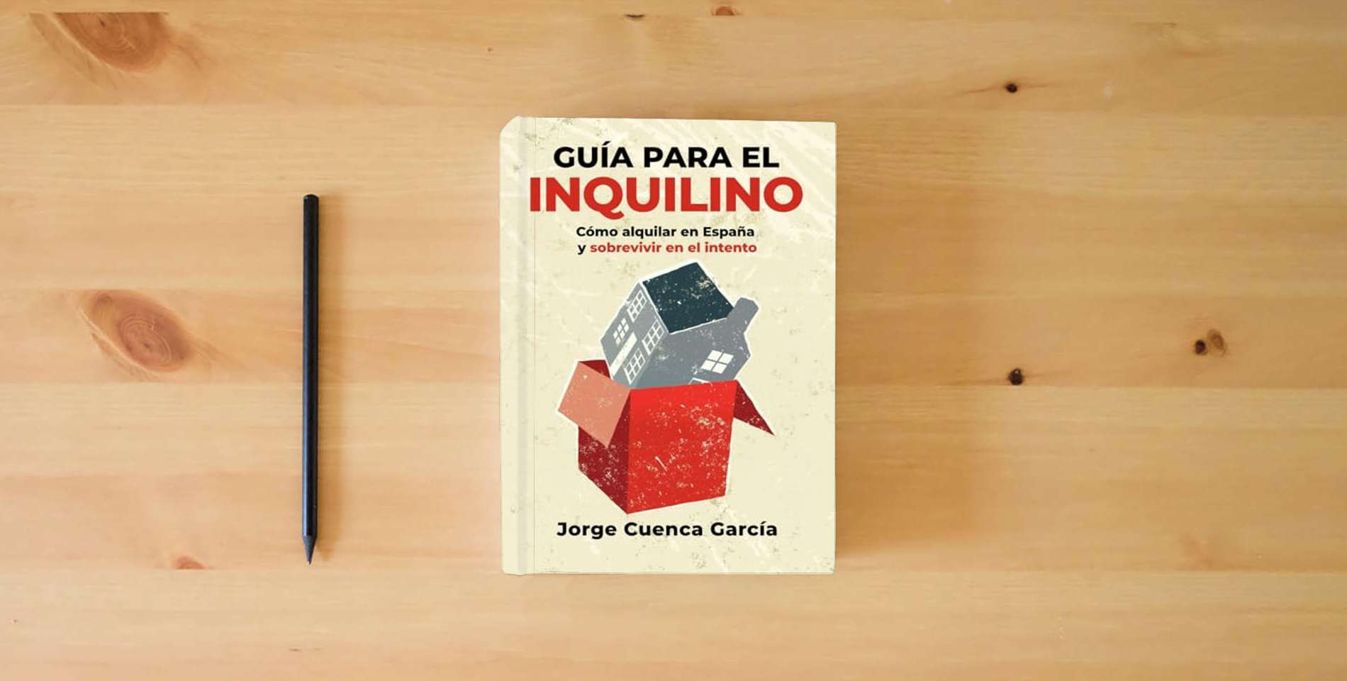The book Guía para el inquilino: Cómo alquilar en España y sobrevivir en el intento is on the table