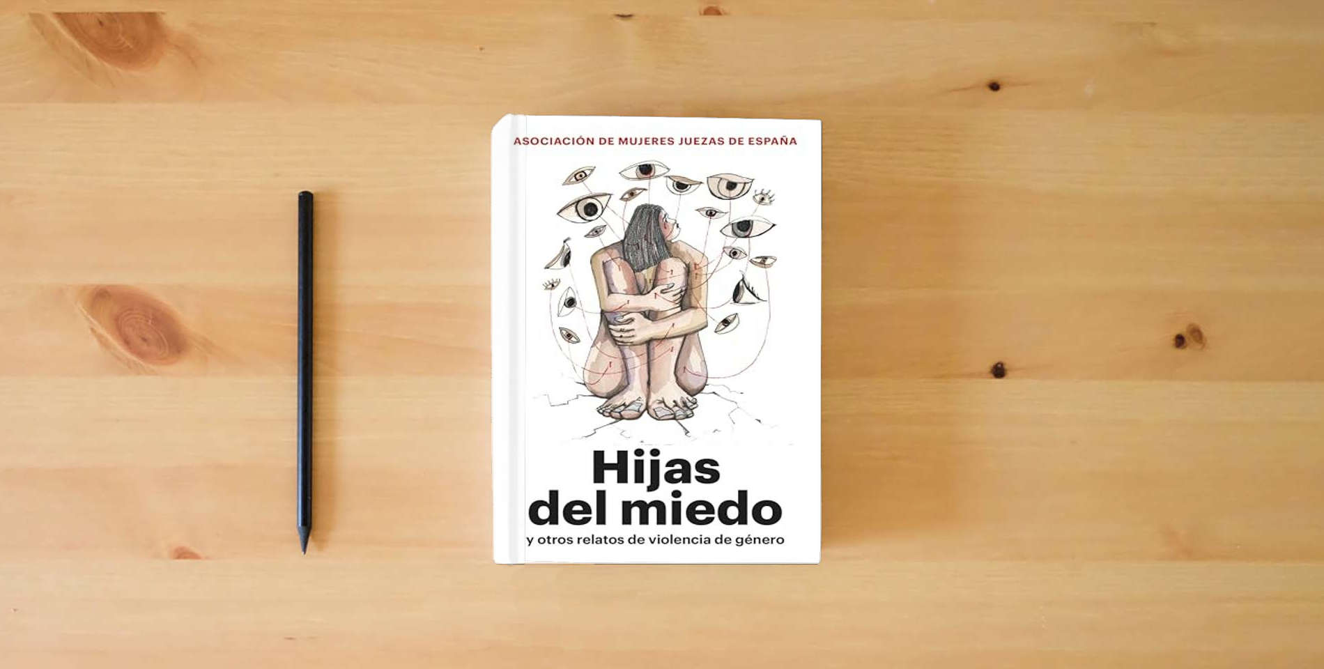 The book Hijas del miedo: y otros relatos de violencia de género (FEMINISMO) is on the table