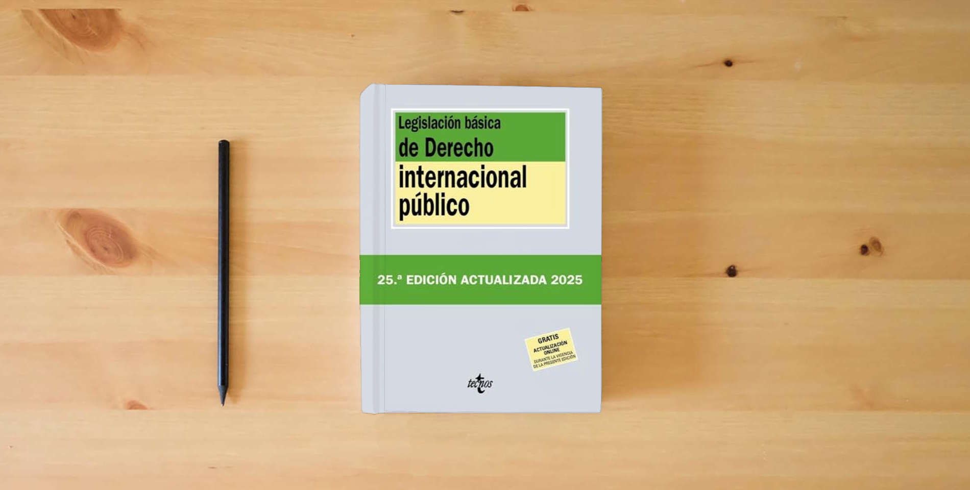 The book Legislación básica de Derecho Internacional público (Derecho - Biblioteca de Textos Legales) is on the table