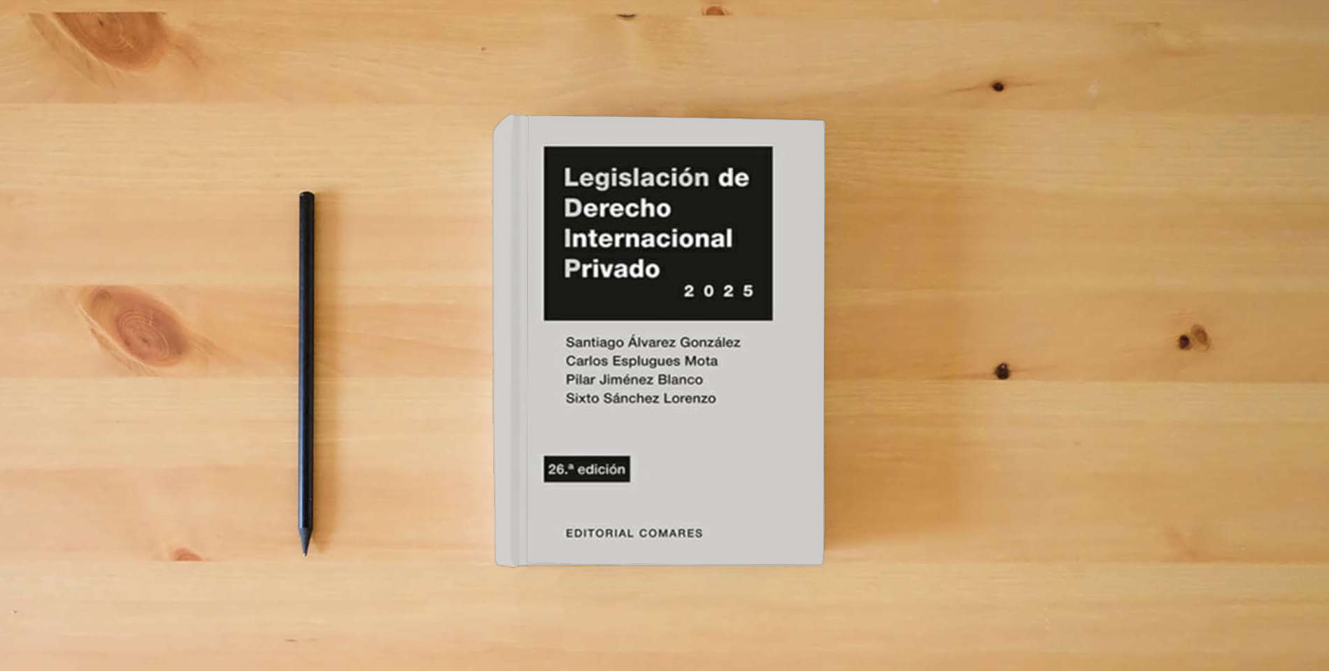 The book Legislación de derecho internacional privado (26 ed.) is on the table