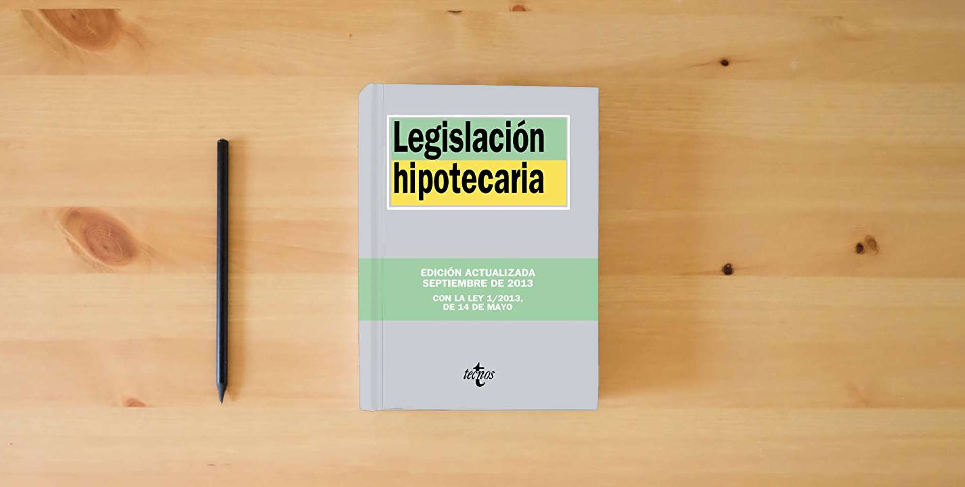 The book Legislación hipotecaria (Derecho - Biblioteca de Textos Legales) is on the table