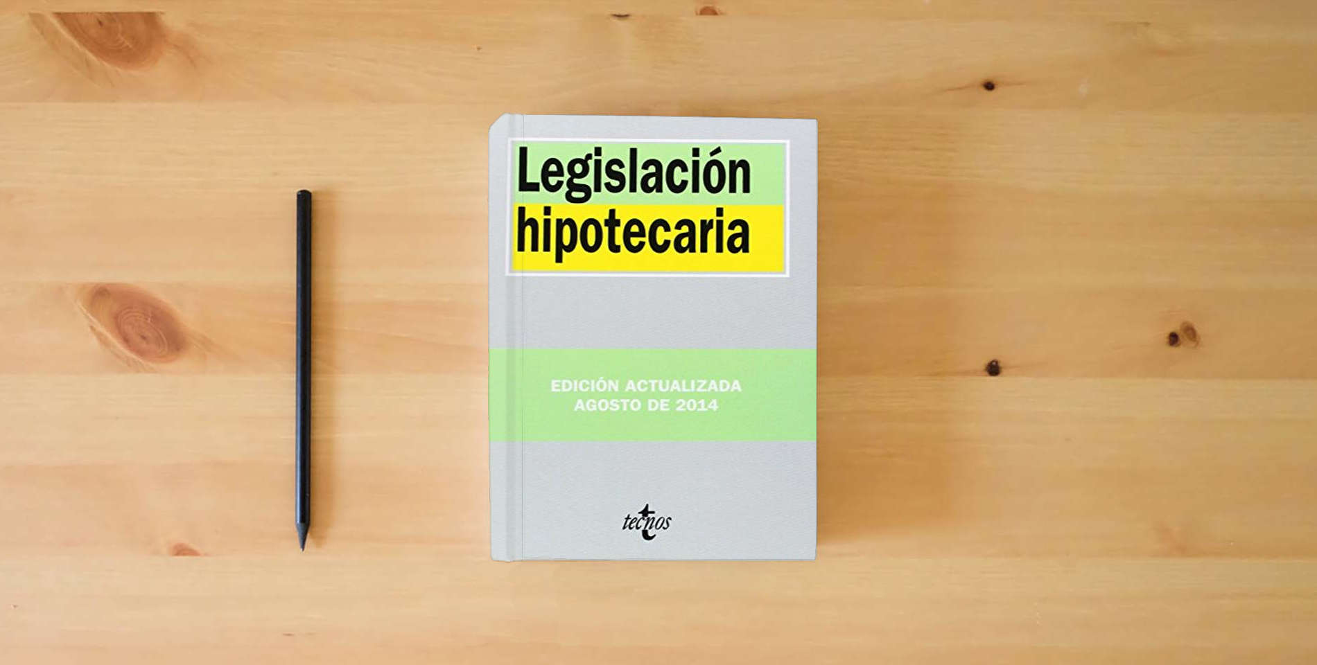 The book Legislación hipotecaria (Derecho - Biblioteca De Textos Legales) is on the table