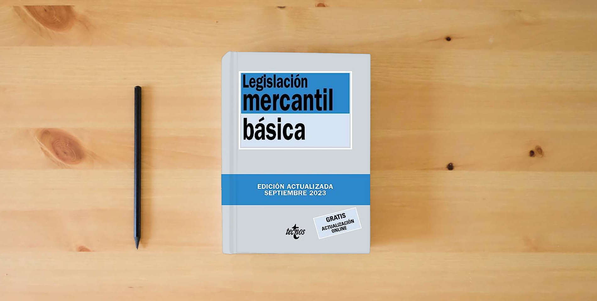The book Legislación mercantil básica (Derecho - Biblioteca de Textos Legales) is on the table