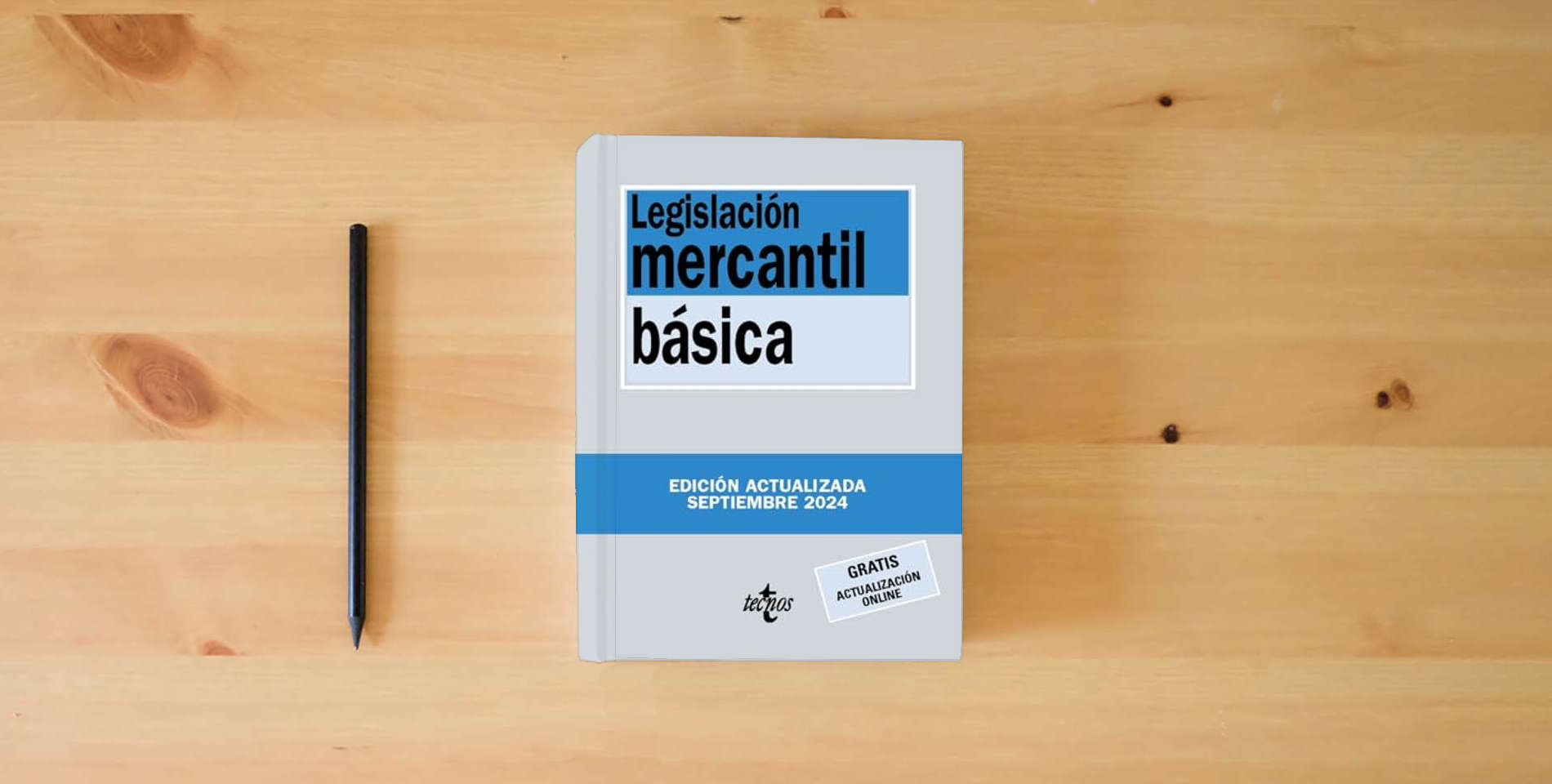 The book Legislación mercantil básica (Derecho - Biblioteca de Textos Legales) is on the table