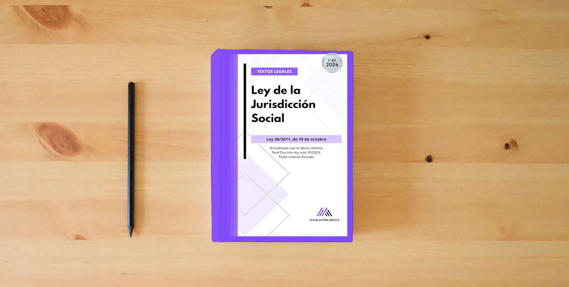 The book Ley de la Jurisdicción Social: Legislación Básica actualizada. Textos legales is on the table