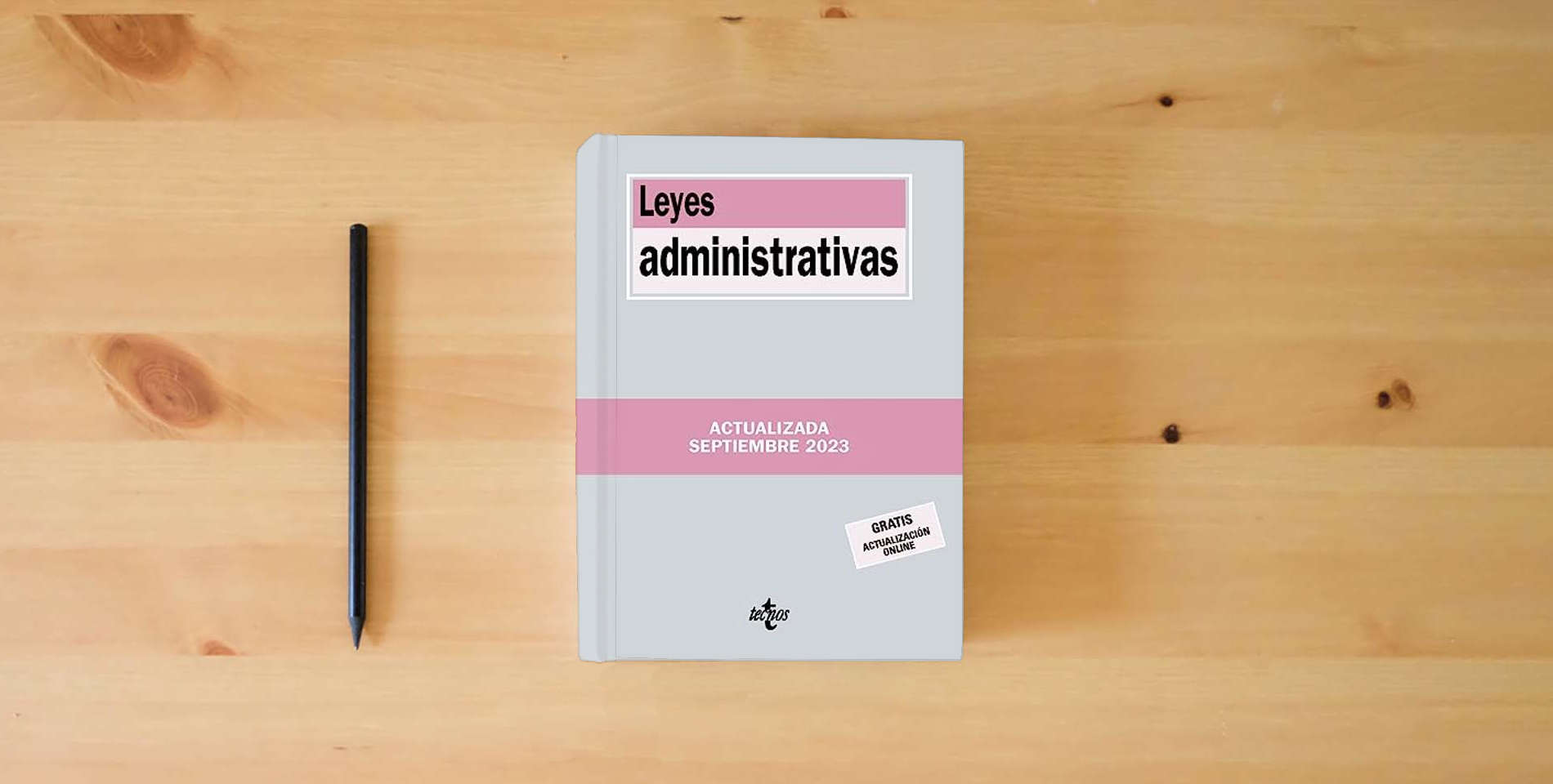 The book Leyes administrativas (Derecho - Biblioteca de Textos Legales) is on the table
