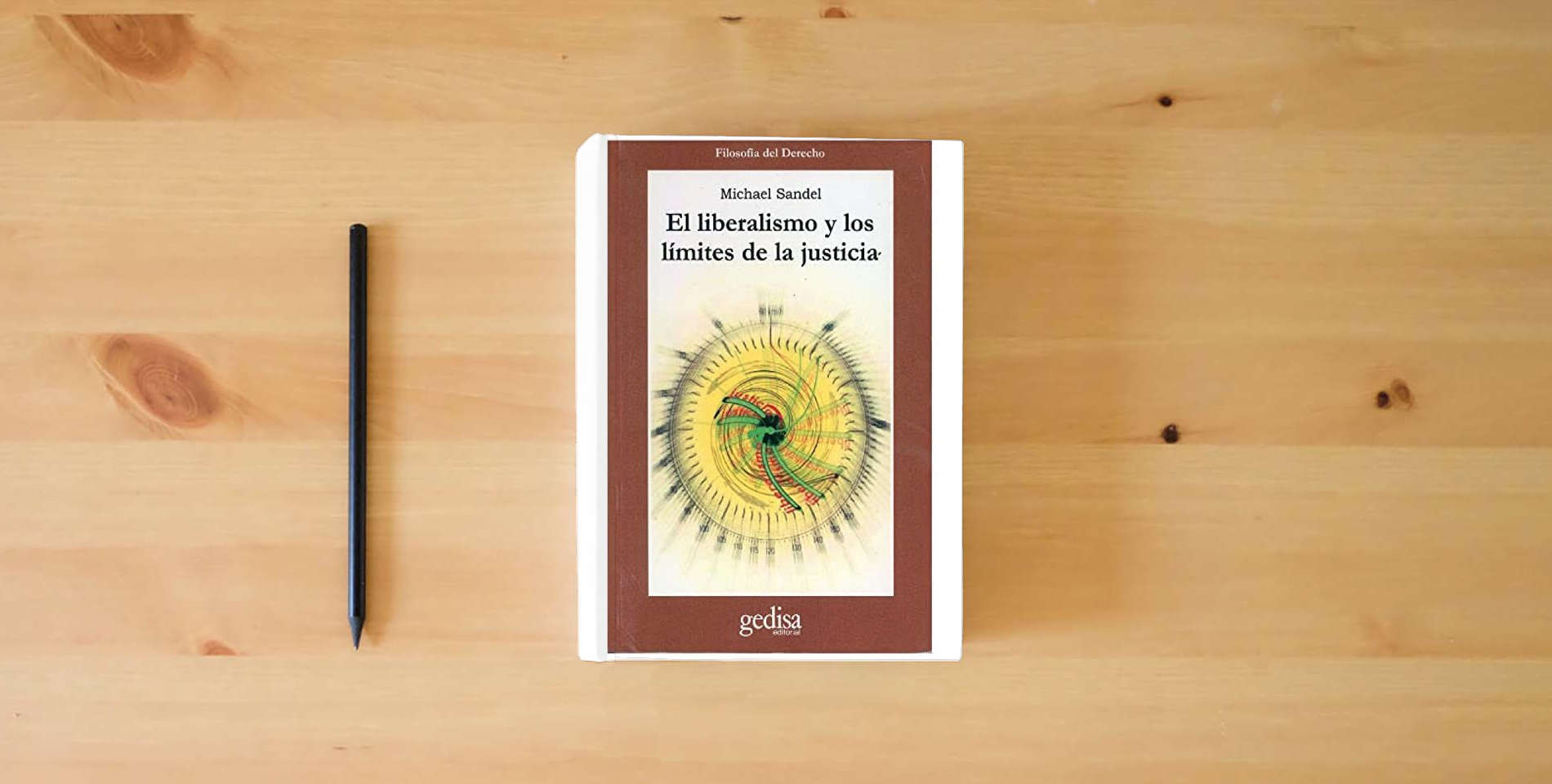 The book Liberalismo y los limites de la justicia (SIN COLECCION) is on the table