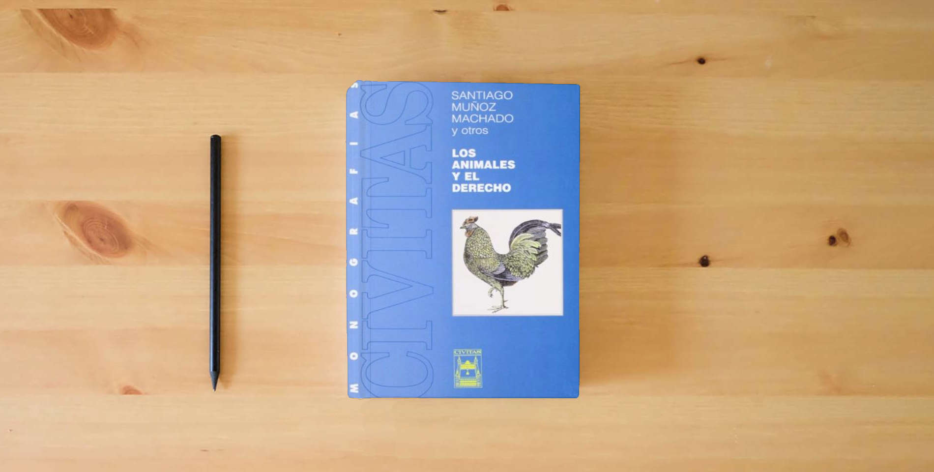 The book Los Animales y El Derecho (Monografía) is on the table