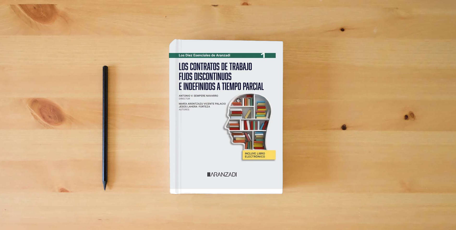 The book Los contratos de trabajo fijos discontinuos e indefinidos a tiempo parcial (Especial) is on the table