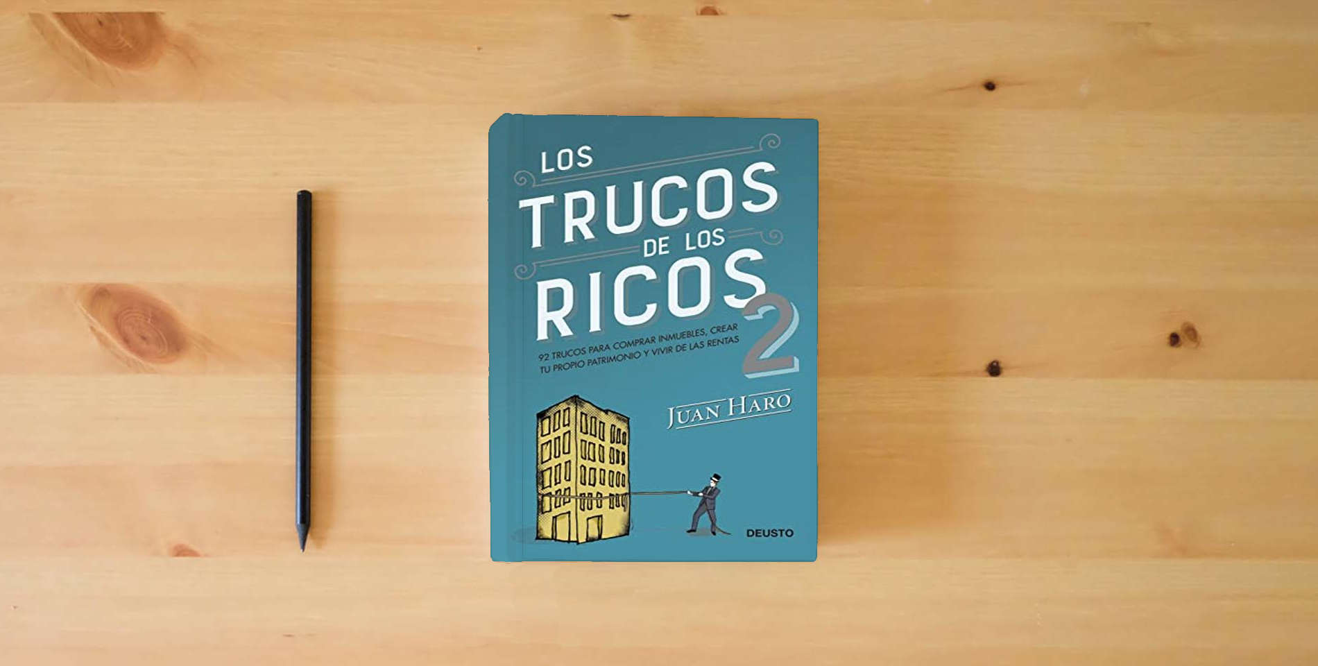 The book Los trucos de los ricos 2ª parte: 92 trucos para comprar inmuebles, crear tu propio patrimonio y vivir de las rentas (Deusto) is on the table
