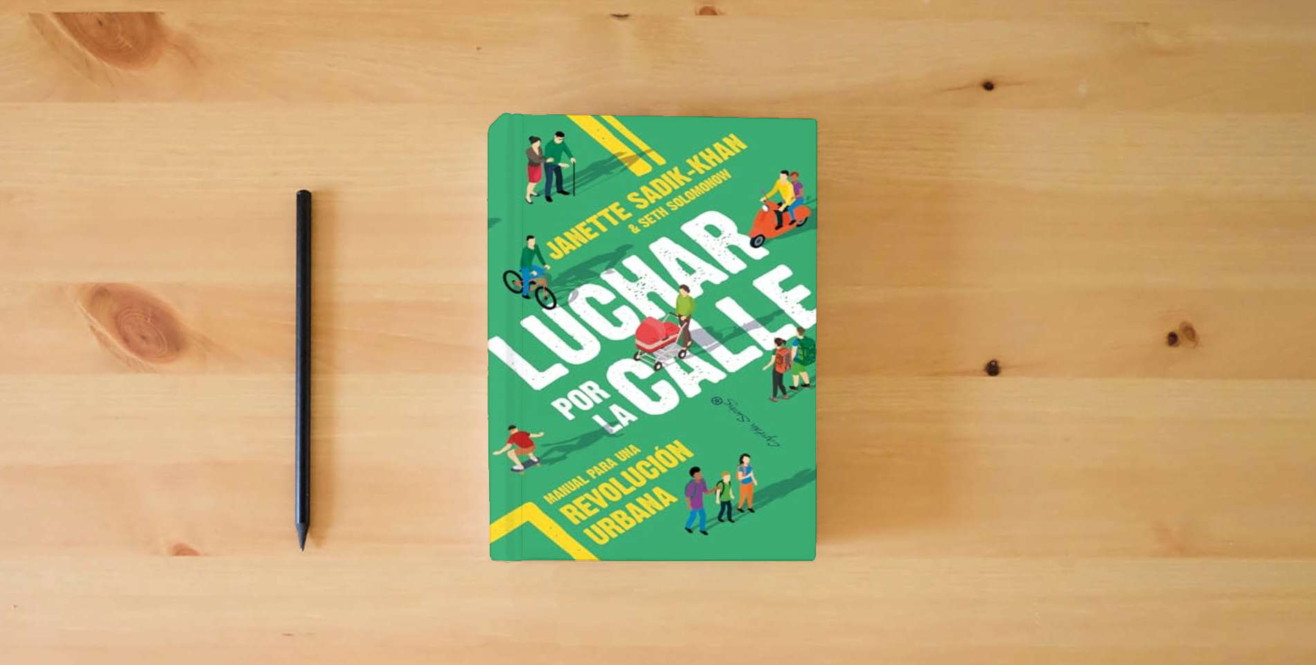 The book Luchar por la calle: Manual para una revolución urbana (ENSAYO) is on the table