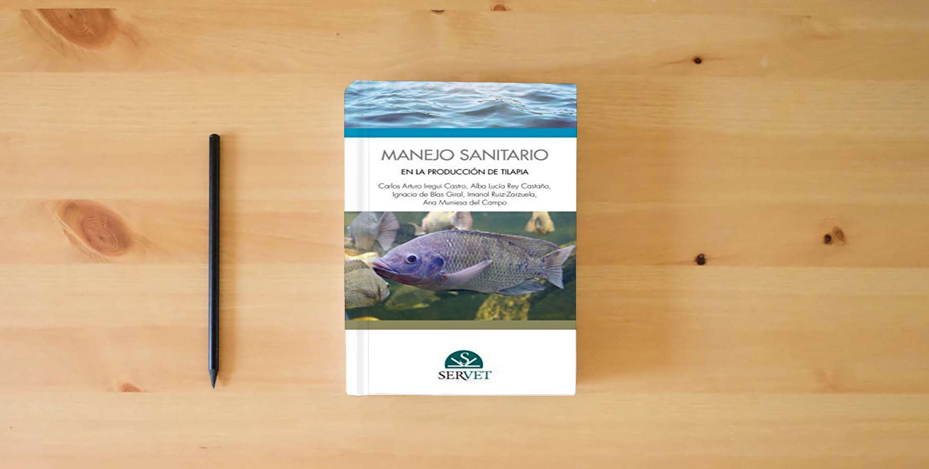 The book Manejo sanitario en la producción de tilapia (MANUALES) is on the table