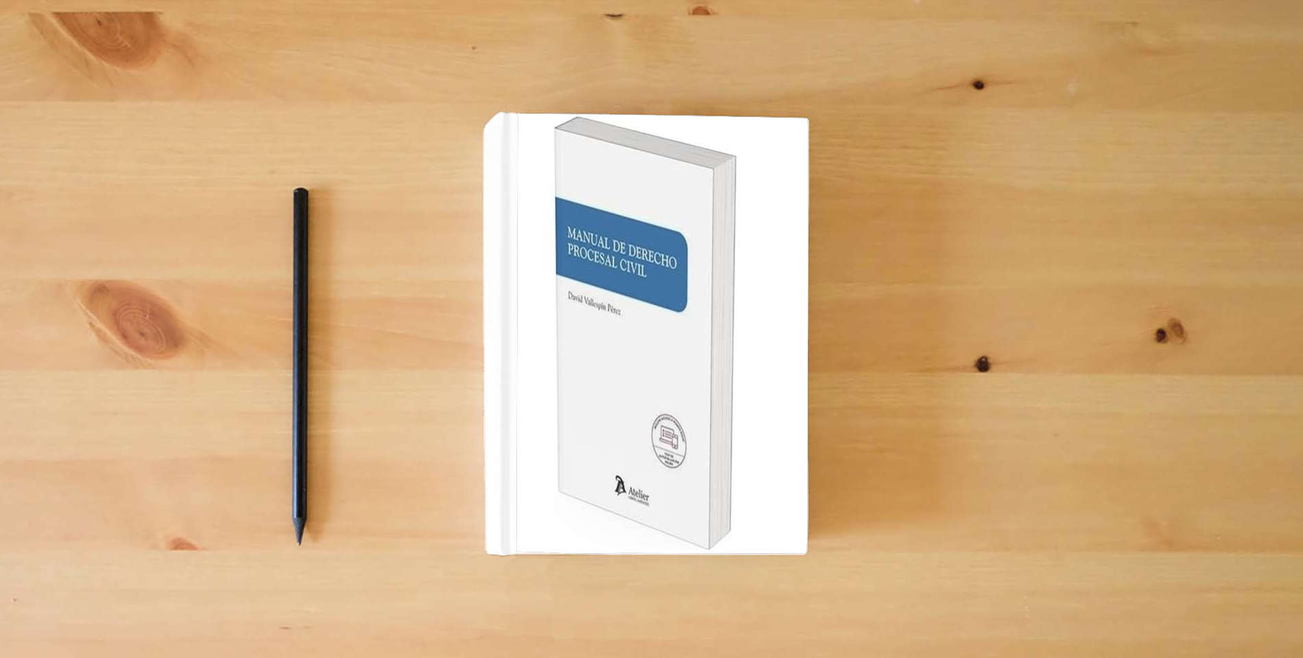 The book Manual de Derecho procesal civil (SIN COLECCION) is on the table