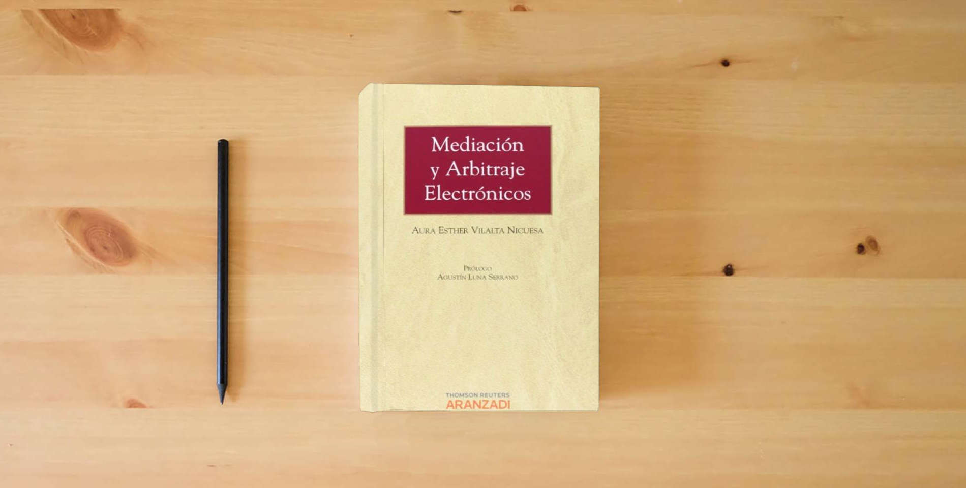 The book Mediación y Arbitraje Electrónicos (Monografía) is on the table