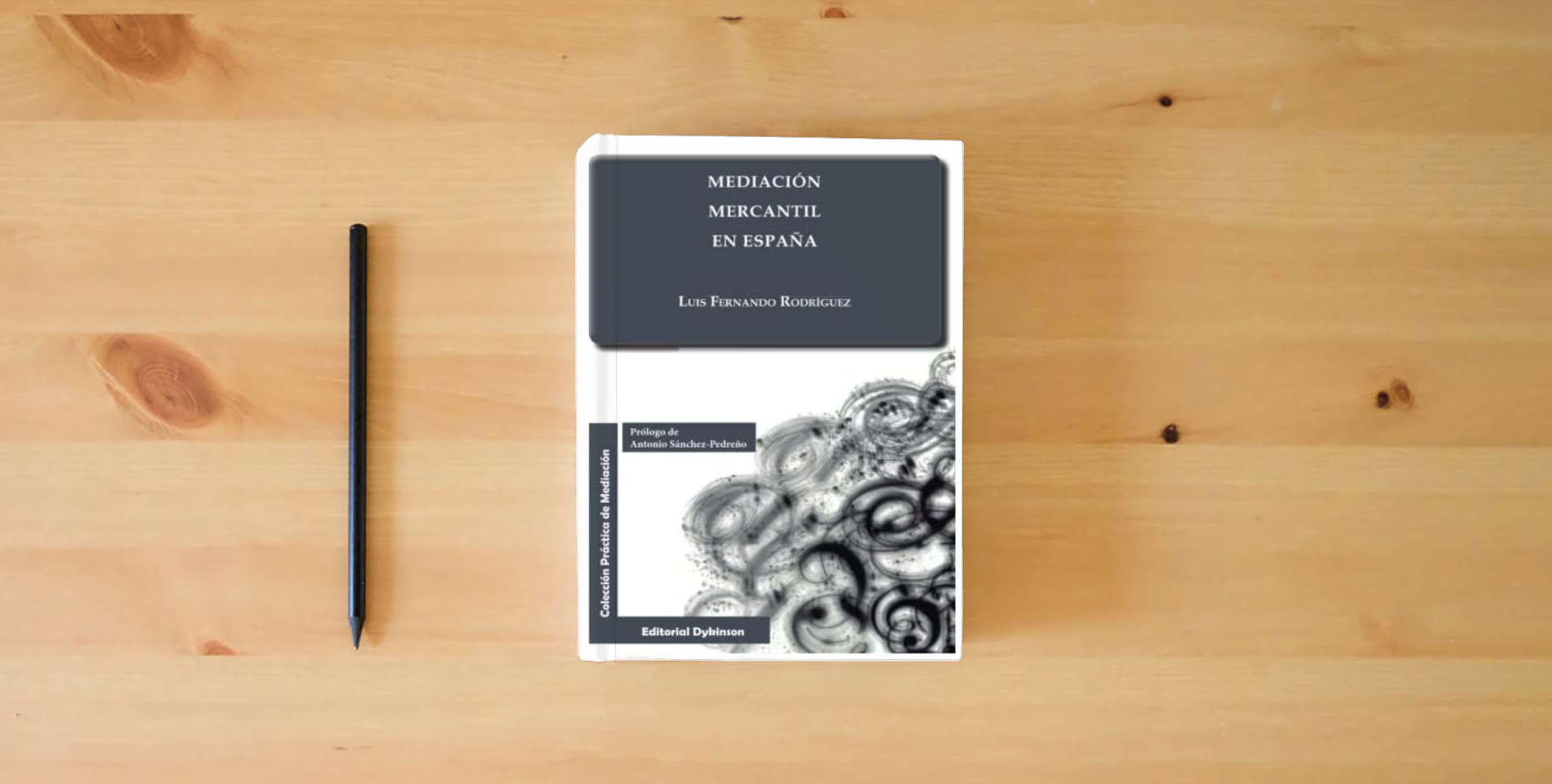 The book Mediación mercantil en España (SIN COLECCION) is on the table