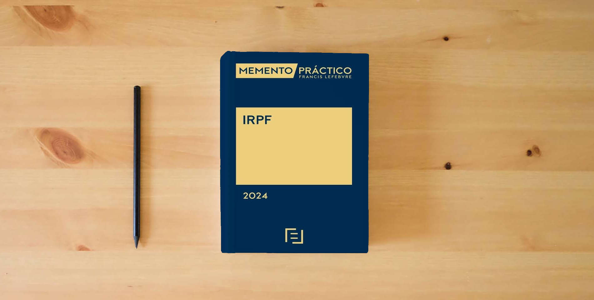 The book Memento IRPF 2024 (MANUALES) is on the table